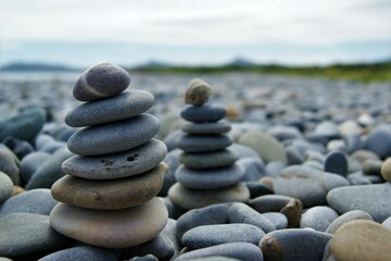 Fototapeta na wymiar Zen towers on a rocky beach.
