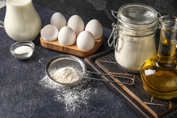 Ingredients for baking on dark table