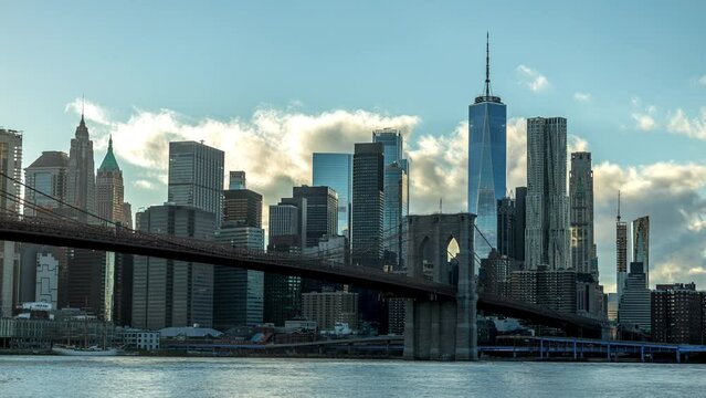 4k day to night holy grail timelapse of the skyline of Manhattan at a sunny day in fall seen from the so called Dumbo, the Brooklyn Bridge Park in Brooklyn, New York City in the USA.