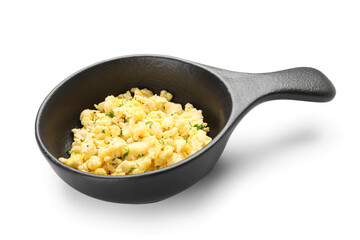 Frying pan with tasty scrambled eggs on white background