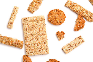 Tasty kozinaki with sesame seeds on white background