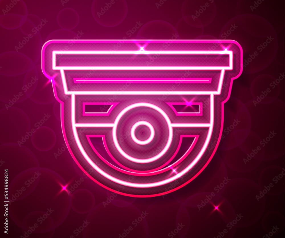 Poster glowing neon line security camera icon isolated on red background. vector