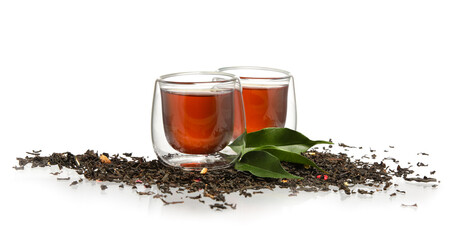 Glass cups of black tea on white background