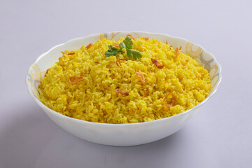 Bengali dish khichdi or khichuri made from a combination of lentils and rice along with Indian spices. in a mud bowl isolated on white background Bengali dish khichdi or khichuri.