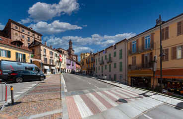 Fossano, Piedmont, Italy - September 09, 2022: Via Marconi with the old colorful houses and the...