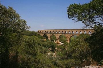 Pont du Gard, Gard, Occitanie, France: famous Roman aqueduct over Gardon river: general view from upstream