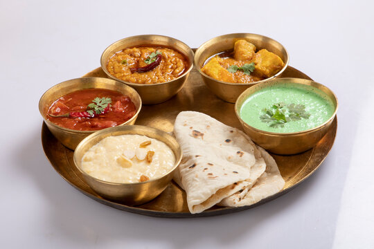 Indian Veg Thali / food platter, selective focus isolated on white background
