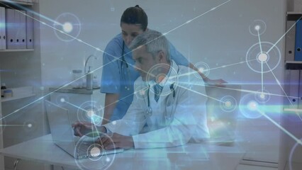 Animation of dots connected with lines and lens flare over caucasian doctors discussing over laptop - Powered by Adobe
