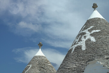 Trulli of Alberobello with moon and clouds
