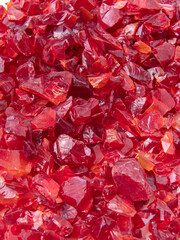 Red decorative glass chips. Broken glass for creativity