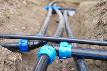 Connecting water supply plastic pipes on ground