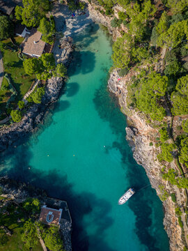 Aerial view of boats in a coastal bay, Cala Marmols, Majorca, Spain