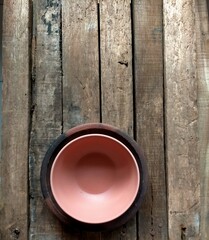 Empty cup and plate on wooden table