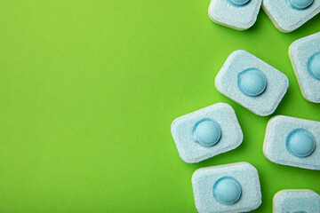 Water softener tablets on green background
.FLAT LAY. Place for text.Space for copy.Top view. Close-up