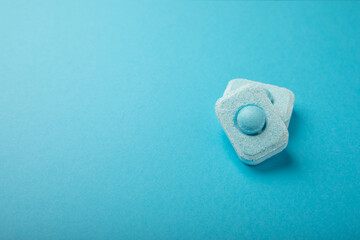 Water softener tablets on a blue background
.FLAT LAY. Place for text.Space for copy.Top view. Close-up