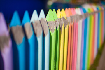 Large colored pencils of all colors of the rainbow