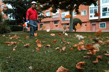 Gardener operating the leaf blower