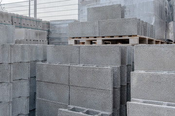 Stack of cement concrete Building cinder blocks brick on pallete in hardware store