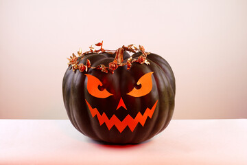 Halloween Pumpkin with Paper Cut Scary Face on a White Background. Jack Halloween. Smile Jack Pumpkin