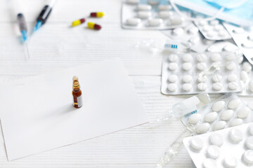 Medications and infection to prevent a pandemic virus. Pills, masks on  white isolated background. ...