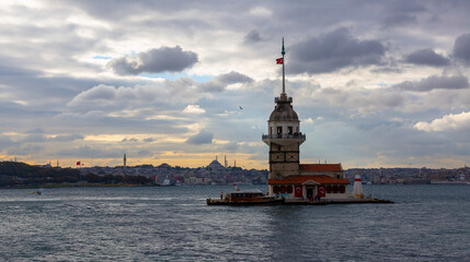 Fiery sunset over Bosphorus with famous Maiden's Tower (Kiz Kulesi) also known as Leander's Tower,...