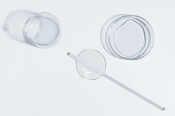 Petri dish, gel, flask, crystallization bowl. Laboratory. View from above. Medicine, gel texture,...