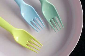 Macro Image of Baby Forks and Dish in Pastel Colors