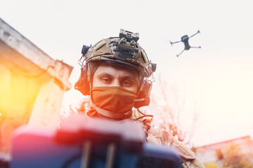 Modern army soldiers using aerial drone for artillery guidance and scouting view enemy positions in...