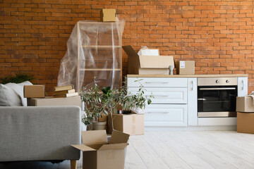 Cardboard boxes in modern kitchen on moving day