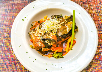 White plate with gourmet vegetarian dish meal in restaurant Mexico.