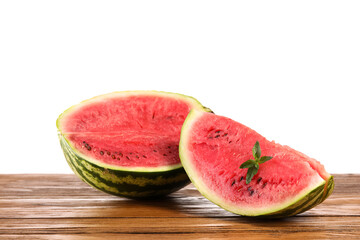 Cut watermelon with mint on table against white background