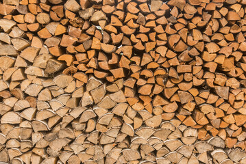 background of split logs, firewood harvesting for winter, heating season