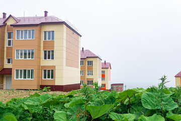cityscape of Yuzhno-Kurilsk town on the island of Kunashir on a cloudy day
