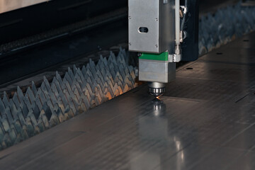 industrial laser cutter during metal sheet processing