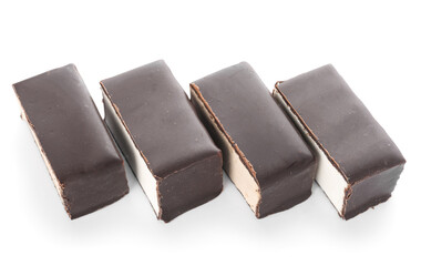 Row of tasty bird's milk candies isolated on white background