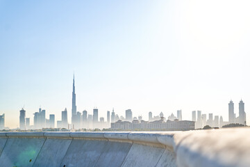 Dubai skyline view over concrete wall