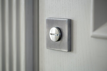 Close-up, door lock in the door, blurred background.