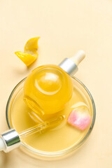 Bowl with bottle of citrus serum on color background, closeup