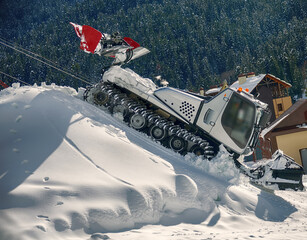 special snowplow (snow-clearing vehicle) removes snow after a snowfall at a ski resort, winter sports resort. - obrazy, fototapety, plakaty