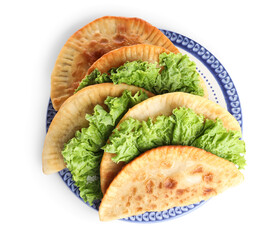 Plate with tasty chebureks and lettuce on white background