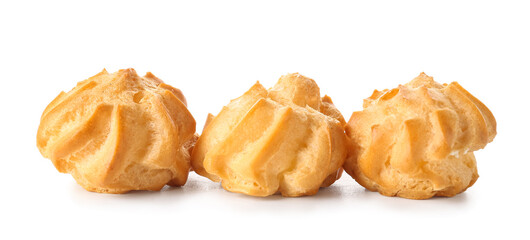Tasty round eclairs on white background