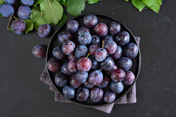 Fresh plums on plate