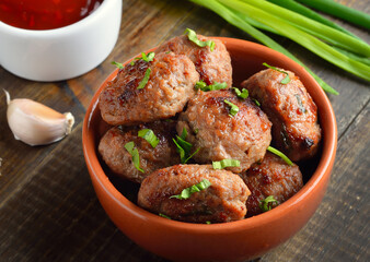 Roasted meatballs in bowl