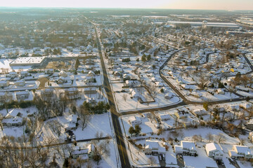 During severe winter storm that hit small American town in New Jersey, roofs residential apartment complexes were covered with snow.