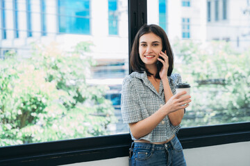 Fototapeta premium Businesswoman looking camera and a meeting about papers and concepts in office