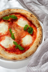 Traditional homemade Italian pizza Margherita on white background, close up