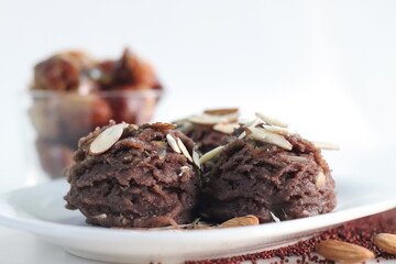 Ragi dates Sheera. Indian pudding made of finger millet flour ghee, milk, dates and dry fruits. Traditionally known as ragi halwa