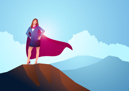 Businesswoman as a superhero standing on the top of a mountain