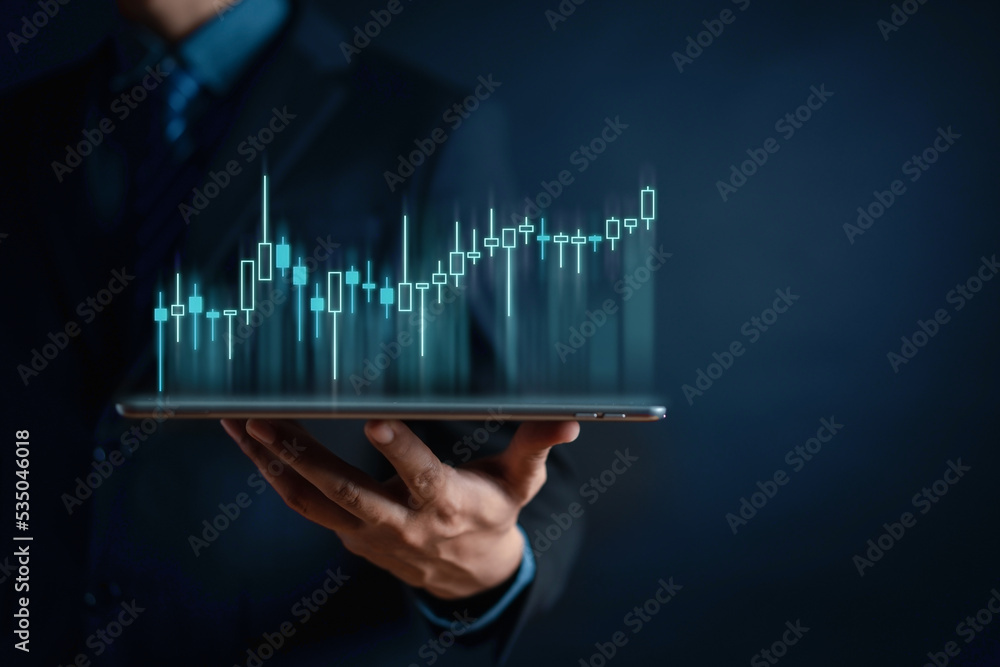 Aufkleber businessman using tablet to analyze sales data trading and showing a growing virtual screen of stati