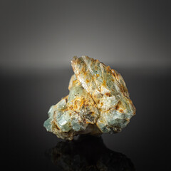 A wonderful item from the mineralogical collection. Beryl mineral crystal on a dark background.